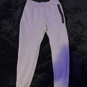 Grey Nike tech pants